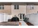 Private backyard with a white fence, walkway, seating, and a grill, ideal for outdoor relaxation and entertaining at 8814 Gerren Ct, Charlotte, NC 28217
