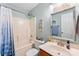 Charming bathroom featuring a tub-shower combo, toilet, and a vanity with a sink and mirror, designed for relaxation at 8814 Gerren Ct, Charlotte, NC 28217
