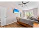 Primary bedroom with en suite bathroom and large window overlooking backyard at 8814 Gerren Ct, Charlotte, NC 28217