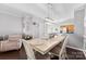 Dining area featuring a decorative light fixture and an adjacent sitting area at 8814 Gerren Ct, Charlotte, NC 28217