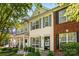 Charming townhouse with blue shutters, landscaping, and a well-maintained front yard at 8814 Gerren Ct, Charlotte, NC 28217
