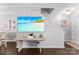 Bright living area showcasing a large television, a staircase, and modern décor at 8814 Gerren Ct, Charlotte, NC 28217