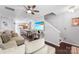 Bright living area with a large television, open layout, and staircase in view at 8814 Gerren Ct, Charlotte, NC 28217