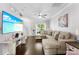 Well-lit living room with open plan and a large sectional sofa at 8814 Gerren Ct, Charlotte, NC 28217