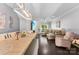 Open-concept living and dining areas with wood floors and neutral paint at 8814 Gerren Ct, Charlotte, NC 28217