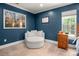 Cozy bedroom featuring a comfy chair, natural light, and warm paint at 900 Springwood Dr, Waxhaw, NC 28173