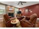 Inviting living room with stone fireplace, hardwood floors and comfortable leather seating at 900 Springwood Dr, Waxhaw, NC 28173