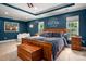 Serene main bedroom with a tray ceiling, plush carpeting, and ample natural light at 900 Springwood Dr, Waxhaw, NC 28173