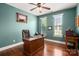 Home office with wood desk, natural light, and neutral wall color at 900 Springwood Dr, Waxhaw, NC 28173