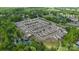 Beautiful aerial view of a well-planned neighborhood with mature trees and a tranquil pond, perfect for families at 9319 Highclere Ct, Matthews, NC 28105