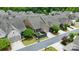 Aerial view displays the home within a friendly neighborhood, highlighted by mature trees and manicured lawns at 9319 Highclere Ct, Matthews, NC 28105