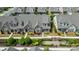 Aerial view of a brick home with manicured landscaping, set in a desirable neighborhood with meticulously kept greenery at 9319 Highclere Ct, Matthews, NC 28105