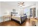 Spacious bedroom featuring a ceiling fan, windows, and two side tables at 9319 Highclere Ct, Matthews, NC 28105