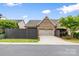 Exterior front view of home with brick accents, garage, and driveway at 9319 Highclere Ct, Matthews, NC 28105