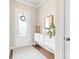 Bright foyer features wood floors, stylish furniture, and decorative mirrors at 9319 Highclere Ct, Matthews, NC 28105