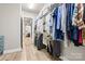 Spacious walk-in closet with ample storage, shelving, and organized hanging space for clothing and accessories at 9319 Highclere Ct, Matthews, NC 28105
