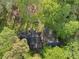 Bird's-eye view of a cozy home nestled in a lush, green wooded lot at 118 Taylor Ct # 16, Mooresville, NC 28117