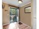 Bright foyer with hardwood floors, featuring a coat rack and mirror, leading to the main living areas at 118 Taylor Ct # 16, Mooresville, NC 28117