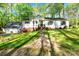 Charming home featuring a well-maintained front yard and a classic exterior design at 118 Taylor Ct # 16, Mooresville, NC 28117