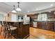 Spacious kitchen with stainless steel appliances, dark wood cabinetry and a breakfast bar with seating at 118 Taylor Ct # 16, Mooresville, NC 28117