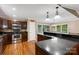 Cozy kitchen boasts stainless steel appliances, granite countertops, and abundant dark wood cabinets at 118 Taylor Ct # 16, Mooresville, NC 28117
