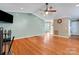 Open-concept living room featuring hardwood floors and a fresh, neutral color scheme at 118 Taylor Ct # 16, Mooresville, NC 28117
