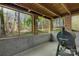 Covered back patio featuring three large windows and a grill, perfect for outdoor dining and entertainment at 118 Taylor Ct # 16, Mooresville, NC 28117