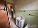 Bathroom featuring older fixtures and partial wall paneling at 135 Hendren Ln, Hiddenite, NC 28636
