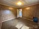 Modest bedroom with carpet and natural light, showcasing a simple design at 135 Hendren Ln, Hiddenite, NC 28636