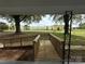 Ramped walkway to the house, offers easy access, framed by trees and view of green lawn at 135 Hendren Ln, Hiddenite, NC 28636