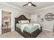 Spacious bedroom featuring a large bed, ceiling fan, and decorative elements throughout the space at 135 Westerwood Dr, Rock Hill, SC 29732