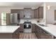 Modern kitchen featuring stainless steel appliances, white countertops, and plenty of cabinet space at 135 Westerwood Dr, Rock Hill, SC 29732