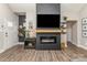 Living room with fireplace and TV, hardwood floors, and decorations at 135 Westerwood Dr, Rock Hill, SC 29732
