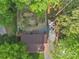 Aerial view of backyard, gazebo, and gravel driveway surrounded by mature trees providing privacy at 1420 Columbus St, Albemarle, NC 28001