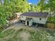 Aerial view of the backyard featuring an outdoor gazebo, shed, a well maintained lawn, and trees at 1420 Columbus St, Albemarle, NC 28001