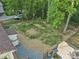 A spacious backyard with trees, a privacy fence, and an outdoor gazebo, perfect for relaxing or entertaining at 1420 Columbus St, Albemarle, NC 28001