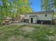 Large backyard features a pergola, steps to back entrance and mature trees at 1420 Columbus St, Albemarle, NC 28001