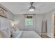 Bright bedroom featuring a ceiling fan, window with natural light, and neutral decor at 1420 Columbus St, Albemarle, NC 28001