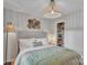 Charming bedroom with woven lighting, a cozy bed, and a closet for organized storage at 1420 Columbus St, Albemarle, NC 28001