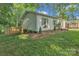 Charming home with green siding, landscaped yard and inviting curb appeal at 1420 Columbus St, Albemarle, NC 28001