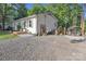 Charming home exterior with gravel driveway, inviting front porch, a gazebo, and beautiful landscaping at 1420 Columbus St, Albemarle, NC 28001