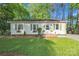 Charming single-story home with well-manicured lawn, flower boxes, and a welcoming front door at 1420 Columbus St, Albemarle, NC 28001