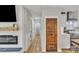 Long hallway connecting rooms with hardwood floors, modern lighting, and detailed trim at 1420 Columbus St, Albemarle, NC 28001