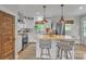 Bright kitchen with white cabinetry, a butcher block island, and stainless steel appliances at 1420 Columbus St, Albemarle, NC 28001