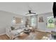 Cozy living room featuring ample natural light, stylish decor, wood accents, and comfortable seating at 1420 Columbus St, Albemarle, NC 28001
