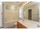 Bathroom features a bathtub, vanity with dual sinks, and a large mirror with modern lighting at 1930 Manning Pl, Rock Hill, SC 29730