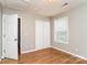 This bedroom features hardwood floors, a double closet, neutral paint and great natural light at 1930 Manning Pl, Rock Hill, SC 29730
