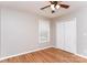 This bedroom offers hardwood floors, a ceiling fan with lighting, and a double door closet at 1930 Manning Pl, Rock Hill, SC 29730