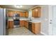 Well-lit kitchen with oak cabinets, stainless steel appliances, and neutral countertop at 1930 Manning Pl, Rock Hill, SC 29730