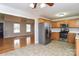 Spacious eat-in kitchen with stainless steel appliances, wooden cabinets, and access to the living room at 1930 Manning Pl, Rock Hill, SC 29730